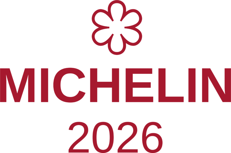 A red Michelin star symbol above the word MICHELIN in bold red letters, with the year 2026 below, celebrates Michael Caines at The Stafford, all set on a light background.